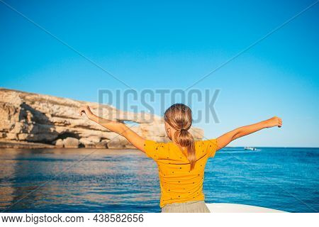 Little Girl Sailing On Boat In Clear Open Sea