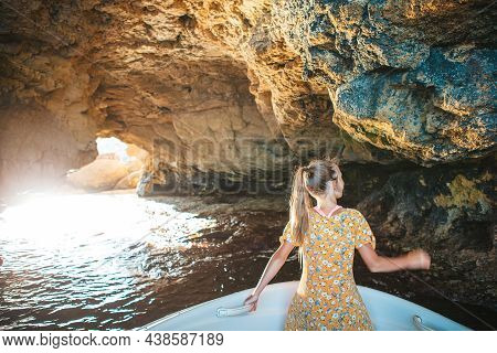 Little Girl Sailing On Boat In Clear Open Sea