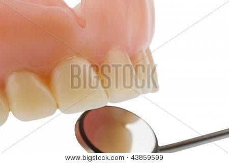 teeth and dental mirror, symbol photo of dentures, diagnosis and copayment