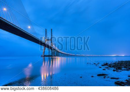 The Vasca Da Gama Bridge Over The River Tagus In Lisbon, Portugal, At Dusk