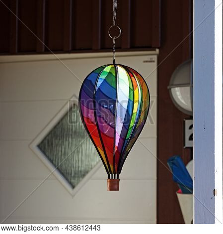 Hot Air Balloon In Rainbow Colors As An Ornament Outside The Door