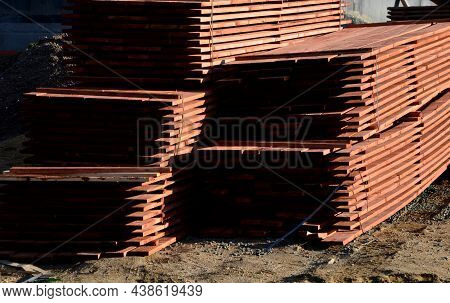 In The Yard We Work With Wooden Prisms And Planks To Repair The Roof. Saw, Cutter, Formats Them To T