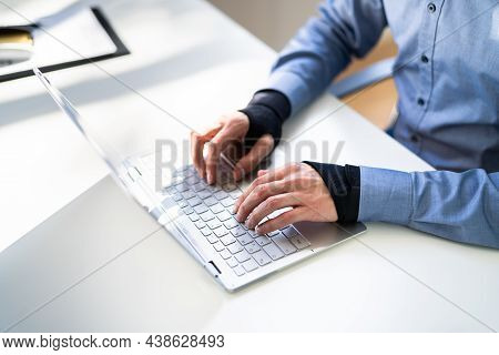 Pain Relief Bandage And Wrist Strap. Typing On Keyboard
