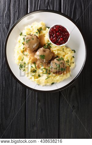 Finnish Meatballs With Gravy Served With Mashed Potatoes And Lingonberry Jam Close-up In A Plate On 