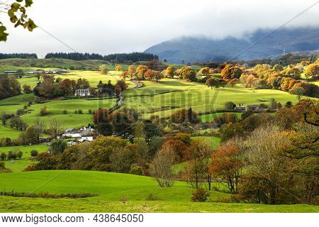 Autumn Landscape, Yellow Green Foliage, Green Grass, Mountains, Clouds. Horisontal Autumn Colorful L