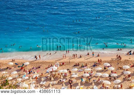 Kas, Turkey - 08. 25. 2021: People Crowd Relaxing On Beach. Swimming People In Sea. Top View Of Kapu