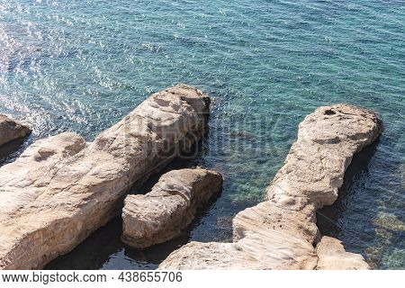 Rocks In The Sea Off The Coast Of Cyprus. Warm Sea And Picturesque Coastal Views In November.