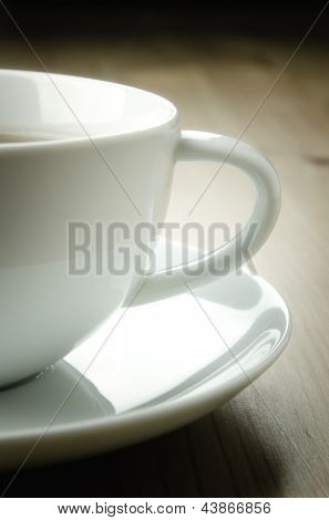 Tazza di tè su fondo in legno, dettaglio