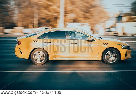 Moscow, Russia - October 2021: Orange Car Kia K5 Fifth Generation Dl3 Speed Driving On Asphalt City 