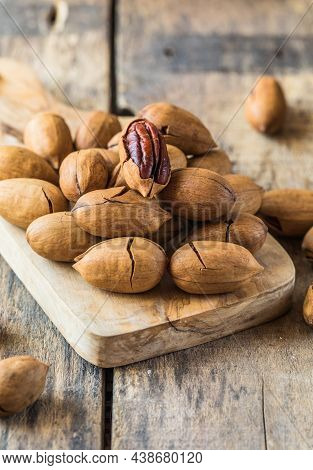 Cracked And Opened Pecan Nuts And Nuts In Shell.cracked And Opened Pecan Nuts And Nuts In Shell.