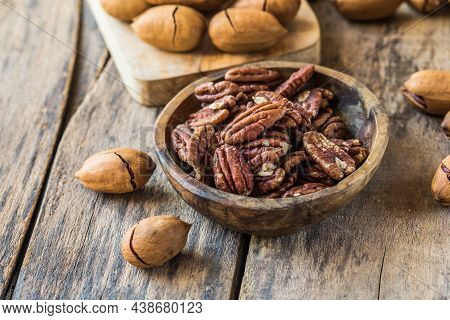 Cracked And Opened Pecan Nuts And Nuts In Shell.cracked And Opened Pecan Nuts And Nuts In Shell.