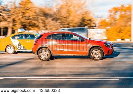 Red Mercedes-benz Gla-class Car Is Driving Along The Street With An Autumn Urban Background. Moscow,
