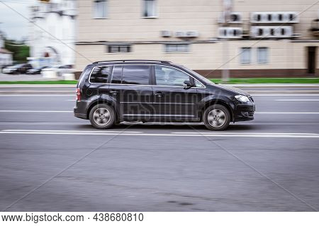 Volkswagen Touran Rides On The City Road With Blurred Background. Family Mpv Vw Touran First Generat