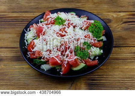 Traditional Bulgarian Shopska Salad On Wooden Table