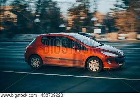 Red Car Peugeot 308 Is Driving Along The Street With An Autumn Urban Background. Moscow, Russia - Oc