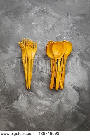 The Vertical Image Shows A Top View Of Cutlery Made Of Environmentally Friendly Materials