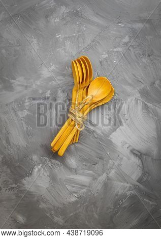 The Vertical Image Shows A Top View Of Cutlery Made Of Environmentally Friendly Materials