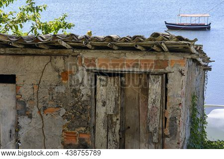 Houses Made Of Clay And Cement On The Banks Of The Grand Paraguacu River.
