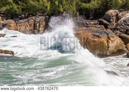 Wave Splash In Rocks With Vegetaion Landscape