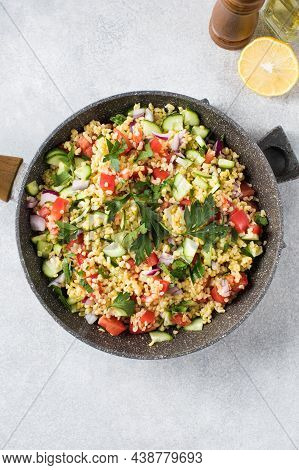 Salad With Bulgur, Tomatoes, Cucumbers And Parsley. Tabouleh Dish. Oriental Cuisine.