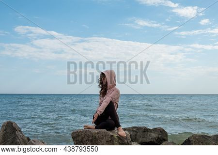 Meditating Yoga. Tranquil Woman. Nature Harmony. Calm Lady Sitting Gomukasana Pose On Rock Stone Azu