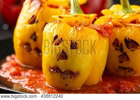 Jack O Lanterns Stuffed Yellow Pepper For Halloween.