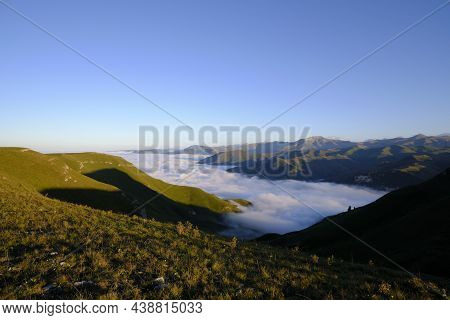 Rivers Of Clouds Descend From Mountain Peaks