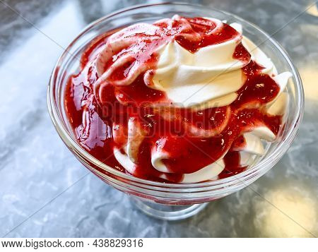 Dessert With Whipped Cream, Strawberry Sauce. Photo.