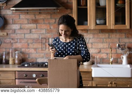 Smiling Latina Female Addressee Shoot Unboxing Parcel On Cell Webcam