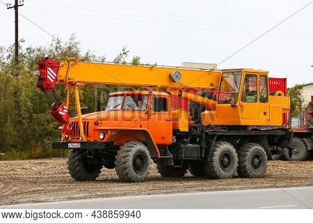 Novyy Urengoy, Russia - August 28, 2021: Old Mobile Crane Ural 4320 In A City Street.