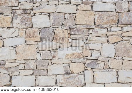 Antique Masonry In Beige Shades. Beautiful Textured Background From Natural Stone. Hand Laid Sandsto