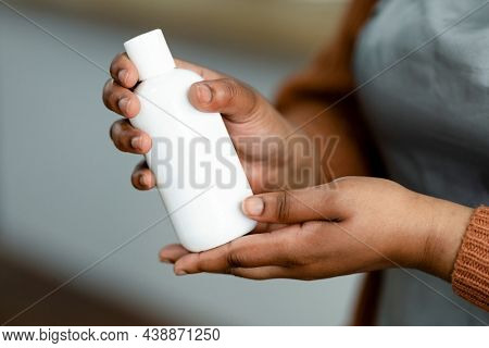 Beauty product bottle being carried