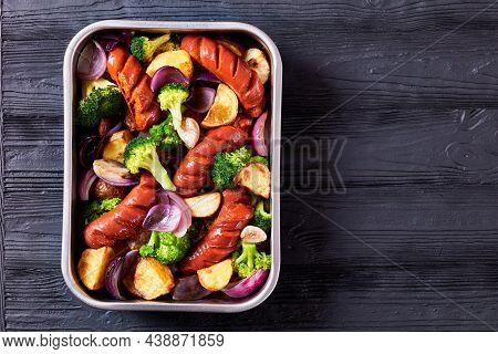 Sausage And Vegetable Traybake With Smoked Pork Sausage, Broccoli, Potato, Red Onion, Garlic On A Ba