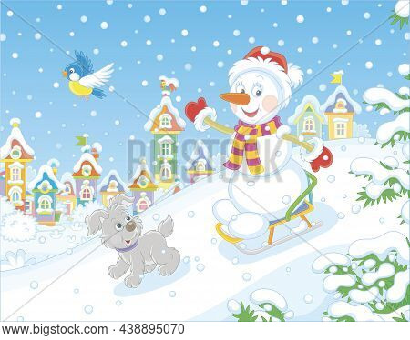 Happy Little Snowman And A Merry Small Puppy Cheerfully Sledding Down A Snow Hill On A Playground In