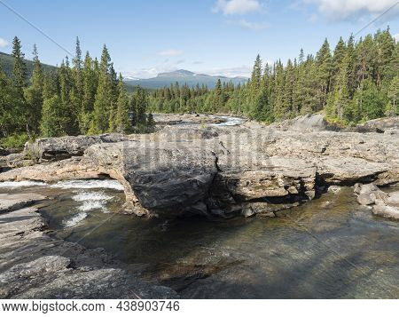Beautiful Northern Landscape With Rapids And Cascades Of Wild River Kamajokk, Boulders And Spruce Tr