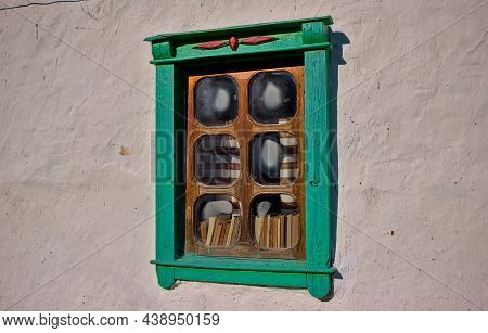 Old Antique Window In A Wooden House In Ukraine. Peasant Traditional One-story Building. National Ar