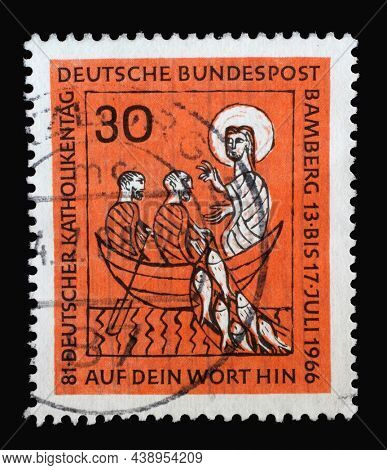 ZAGREB, CROATIA - JUNE 27, 2014: Stamp printed in Germany showing a picture with Jesus and two disciples fishing, 81st German Catholic Day in Bamberg, circa 1966