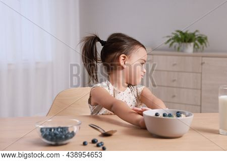 Cute Little Girl Refusing To Eat Her Breakfast At Home