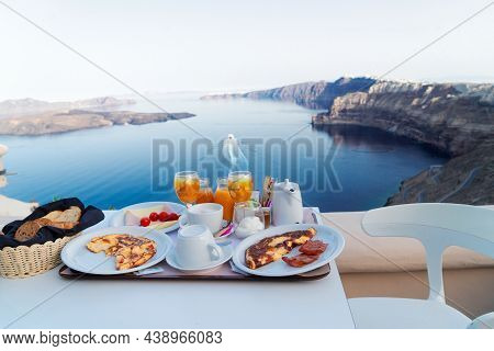 Breakfast For Two With Coffee, Fresh Orabge Juice And Yogurt At Morning By Seaside