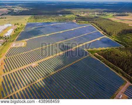 Solar Power Plant In The Field. Aerial View Of Solar Panels.