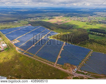 Solar Power Plant In The Field. Aerial View Of Solar Panels.