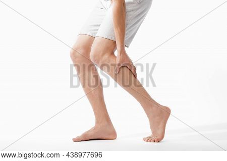Cropped Millennial Caucasian Male Athlete Massaging His Leg And Suffering From Shin Pain