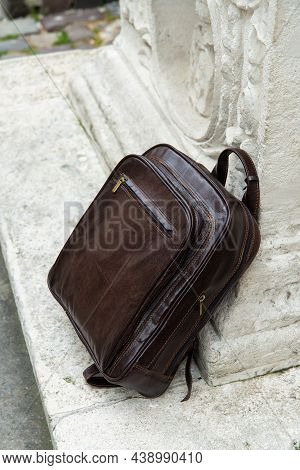 Brown Leather Backpack On The Snone Monument