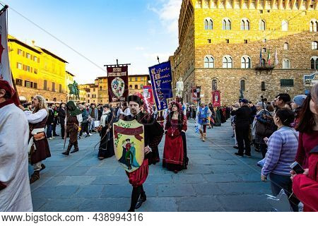 FLORENCE, ITALY - NOVEMBER 30, 2019: Carnival participants and enthusiastic spectators. Great costumes and equipment of the participants.  Fancy-dress ball in the Signoria square. 