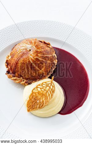 Tenderloin with pork, mushrooms and sirloin puff pastry on a white background. Homemade meal for wellington.