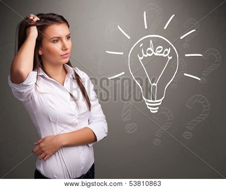 Pretty young girl comming up with a light bubl idea sign