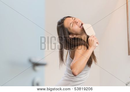Sexy Playful Woman With A Hairbrush