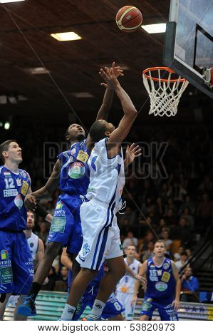 KAPOSVAR, HUNGARY ÃÂ¢Ã?Ã? OCTOBER 26: Louis Hinnant (in white) in action at a Hungarian Championship basketball game with Kaposvar (white) vs. Fehervar (blue) on October 26, 2013 in Kaposvar, Hungary.