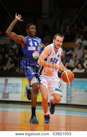 KAPOSVAR, HUNGARY ÃÂ¢Ã?Ã? OCTOBER 26: Hrvoje Puljko (in white) in action at a Hungarian Championship basketball game with Kaposvar (white) vs. Fehervar (blue) on October 26, 2013 in Kaposvar, Hungary.