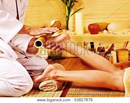 Woman getting feet massage Male therapist.
